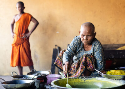 Elderly woman cooking for the monastery